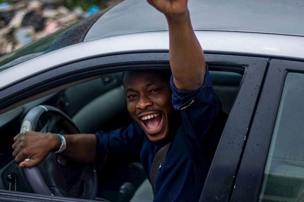 A man happy to celebrate his driving test result